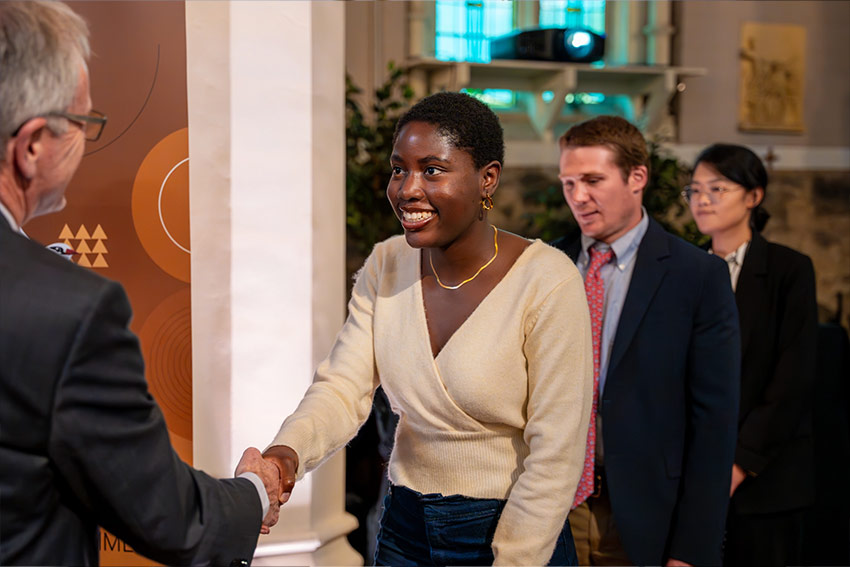 A ceremonial handshake for excellent achievers